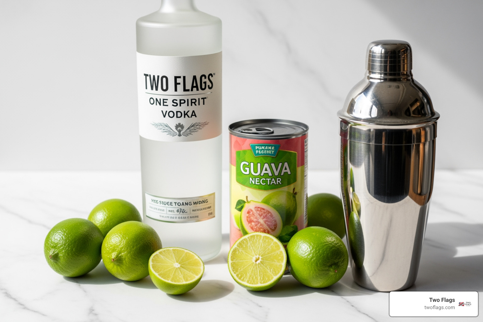 essential ingredients laid out: a bottle of Two Flags One Spirit Vodka, a can of guava nectar, fresh limes, and a shaker - guava vodka cocktail