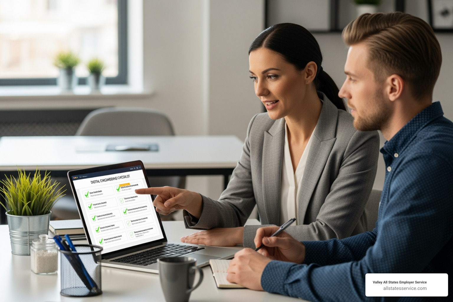 A manager and new hire collaborating at a desk, with a laptop displaying an onboarding checklist. - New employee onboarding