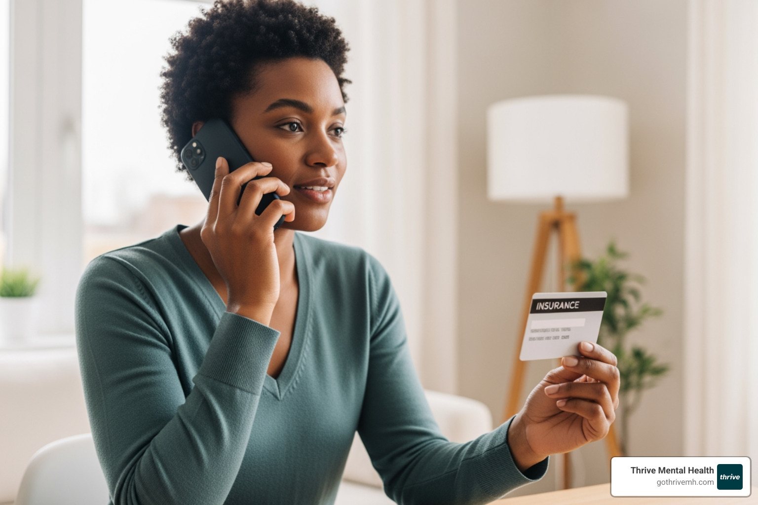 Person on phone with insurance card - Which intensive outpatient programs in Florida accept BCBS of FL?