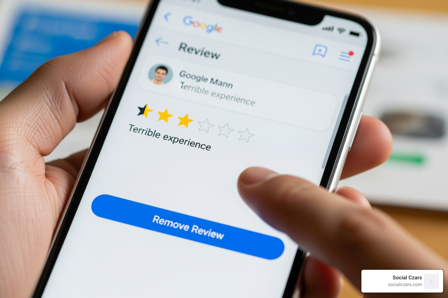 screenshot of google business profile review section with a red box around the "Report review" button - how to remove 1 star reviews google