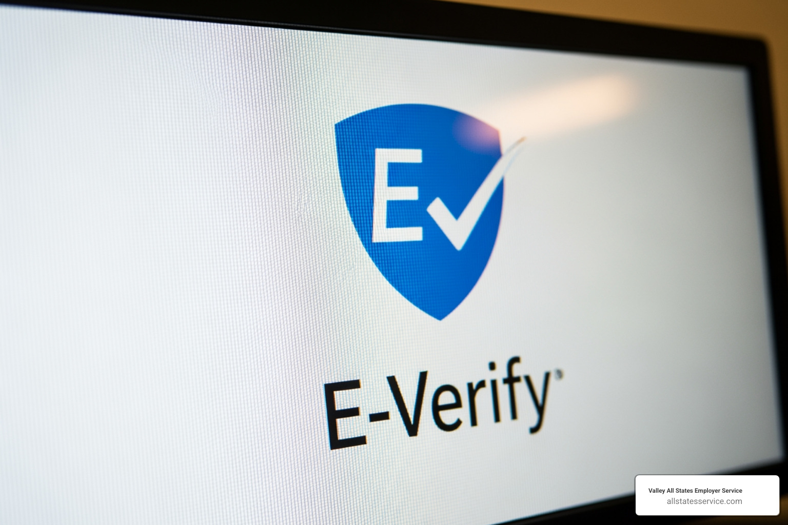 E-Verify logo on computer screen - employment verification department of homeland security E-Verify logo on computer screen - employment verification department of homeland security