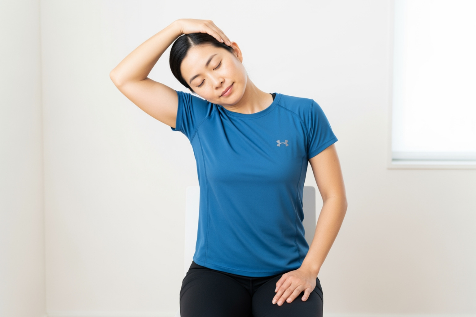 person demonstrating seated upper trapezius stretch - upper trapezius stretch person demonstrating seated upper trapezius stretch - upper trapezius stretch