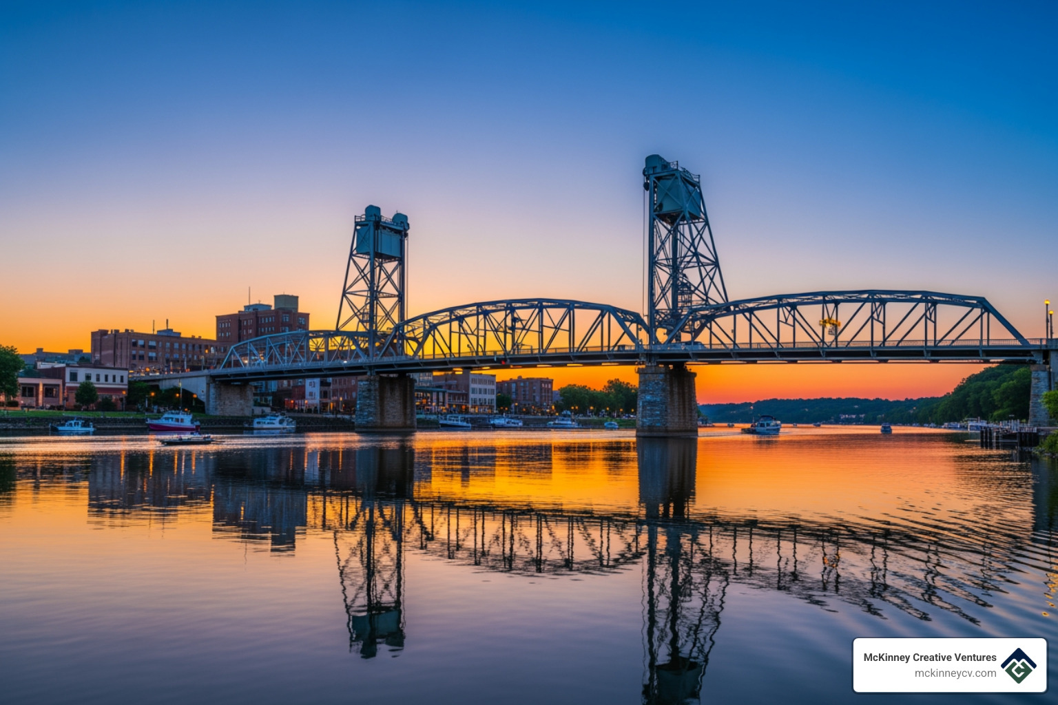 A scenic image of the Stillwater Lift Bridge reflecting in the St. Croix River, with downtown Stillwater in the background - content creation services A scenic image of the Stillwater Lift Bridge reflecting in the St. Croix River, with downtown Stillwater in the background - content creation services