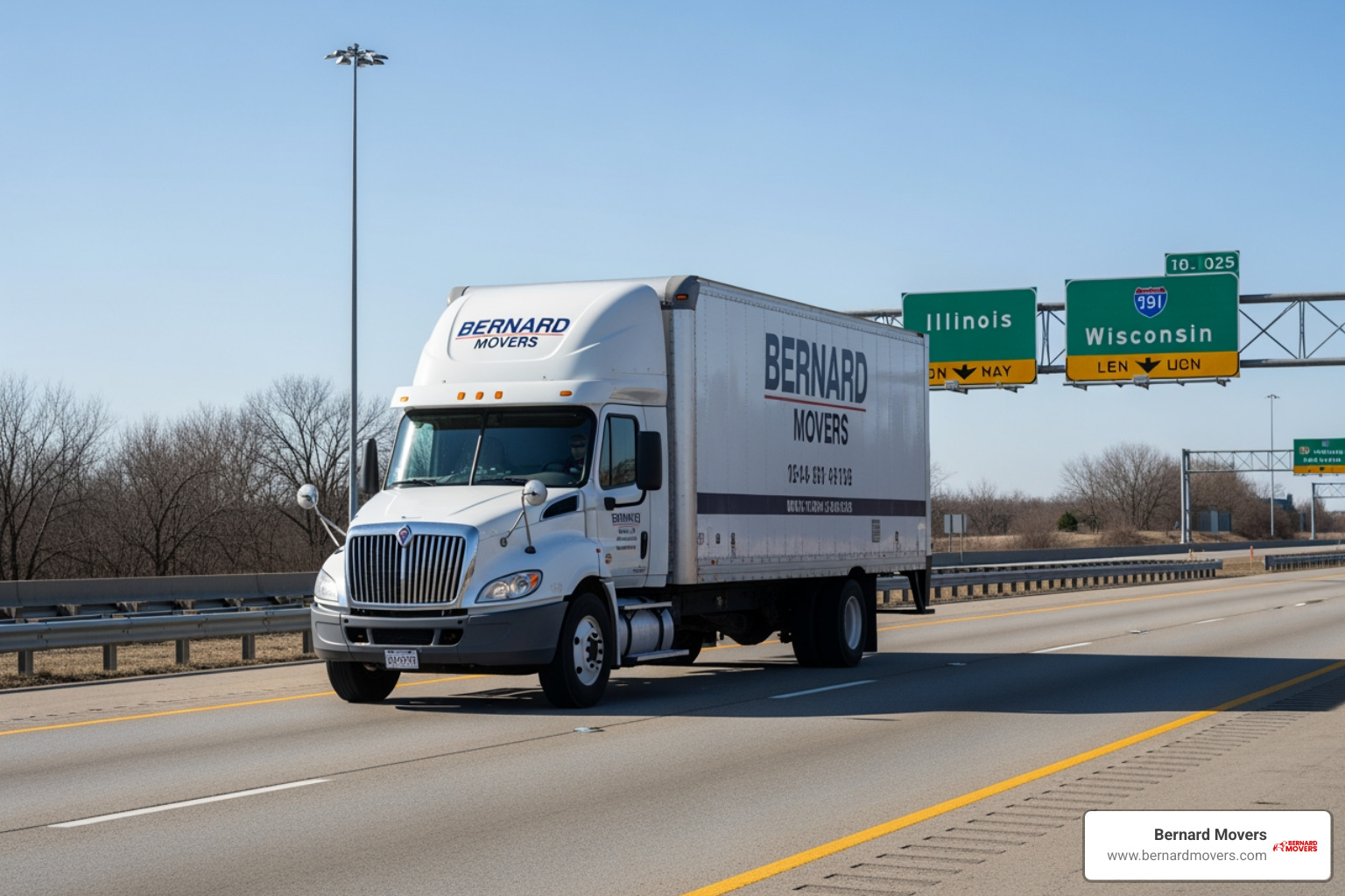 Bernard Movers truck on a highway with Illinois and other state signs in the background - interstate moving company rates