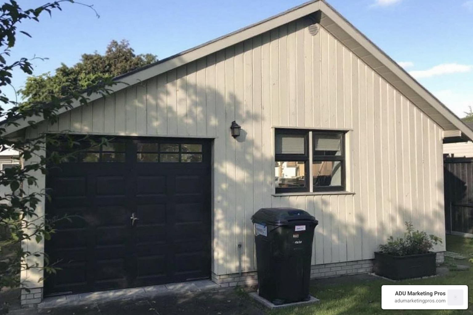 Architect's blueprint for a garage conversion ADU laid out on a table - convert garage into granny flat
