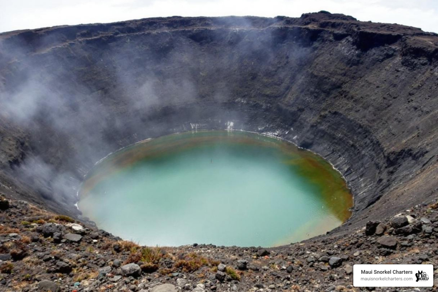 A bottle of reef-safe sunscreen next to a snorkel mask - molokini crater trip A bottle of reef-safe sunscreen next to a snorkel mask - molokini crater trip