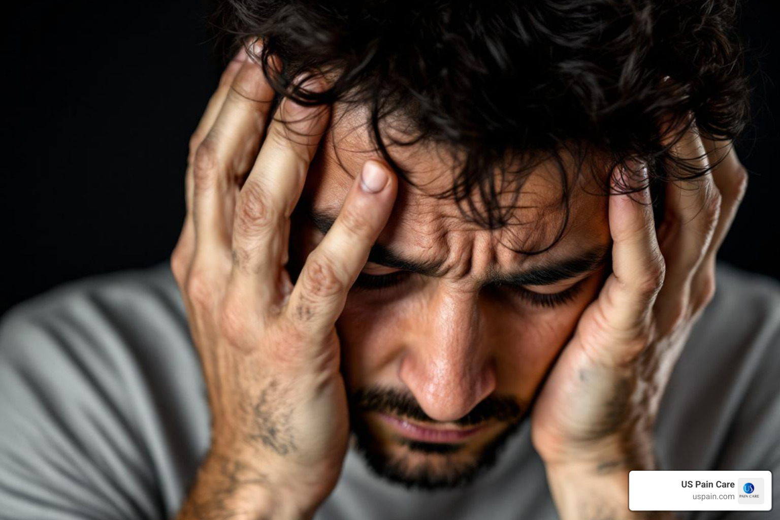 person holding their head in their hands looking distressed - depression