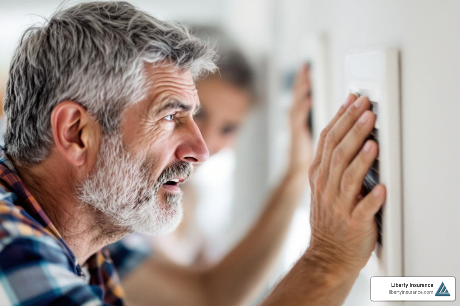 a homeowner listening to a noisy air vent - HVAC system breakdown