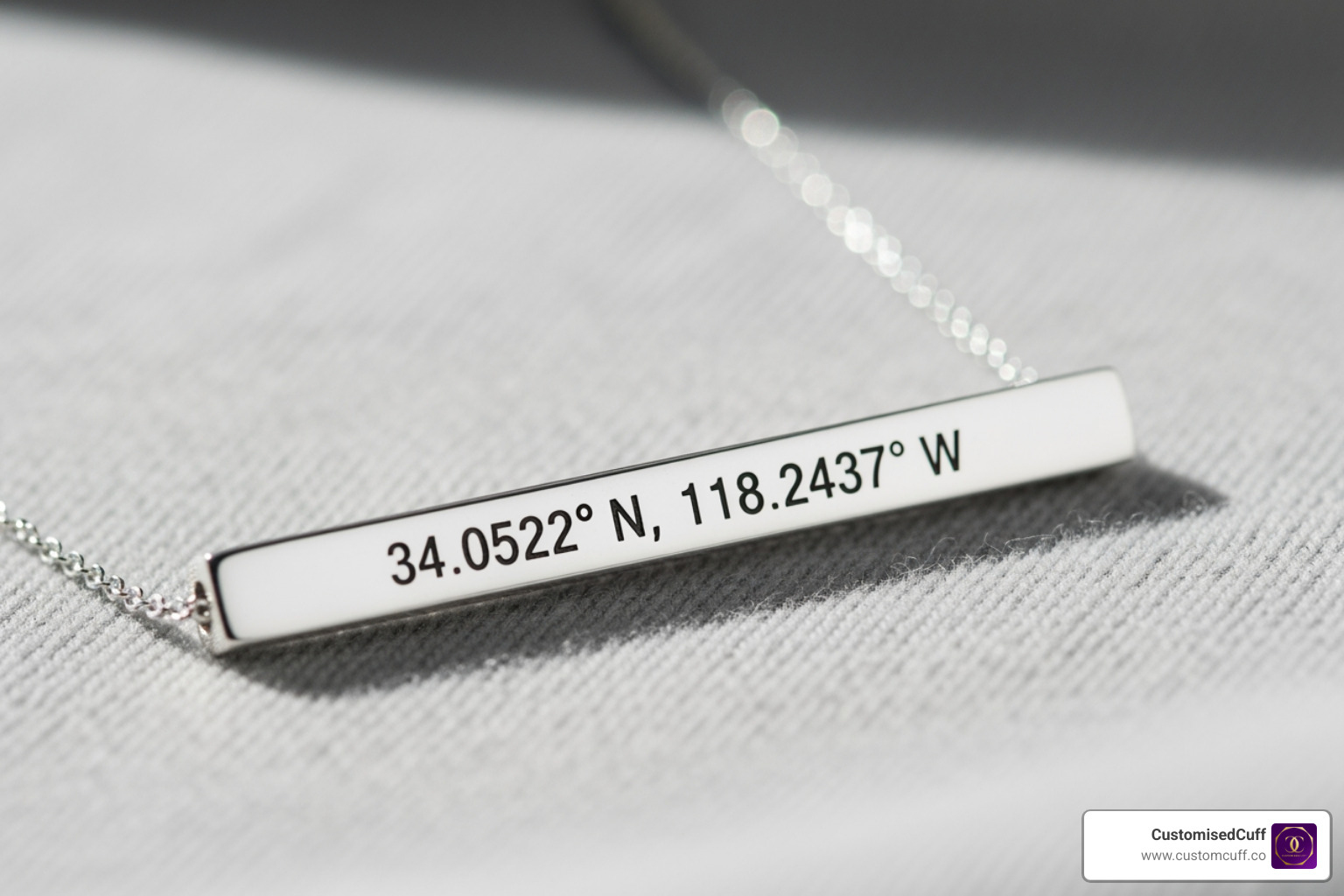 close-up on an engraved coordinates necklace - latitude and longitude necklace sterling silver