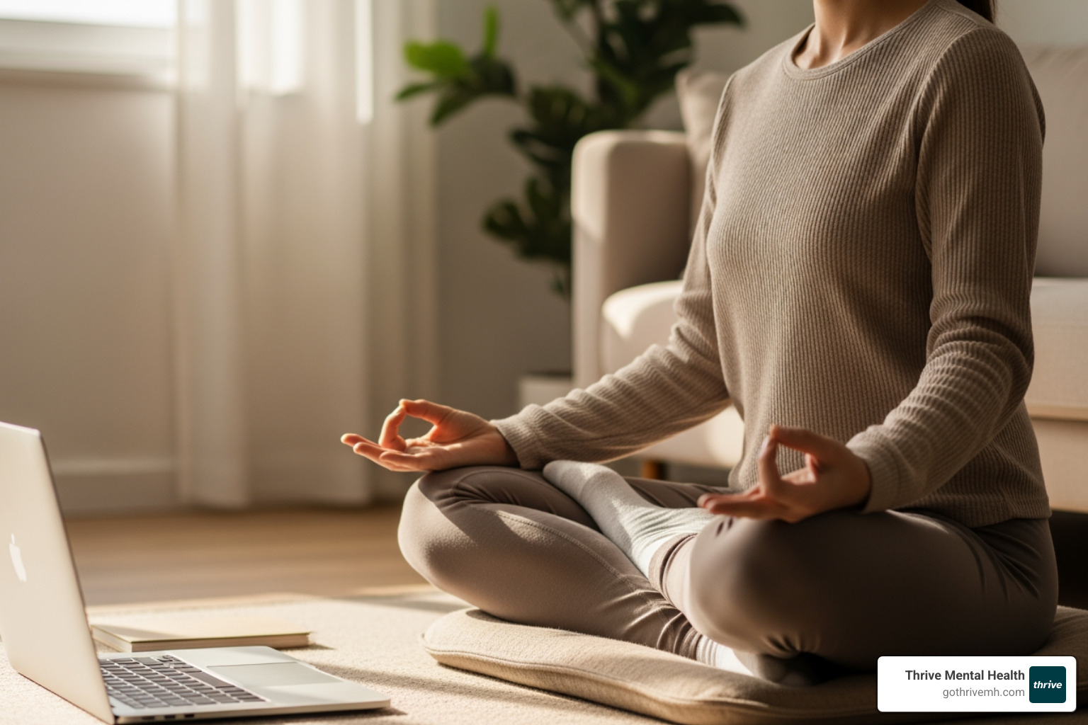 Person meditating at home, laptop nearby; Alt text: "Virtual IOP Florida—meditation and therapy from home." - virtual iop florida