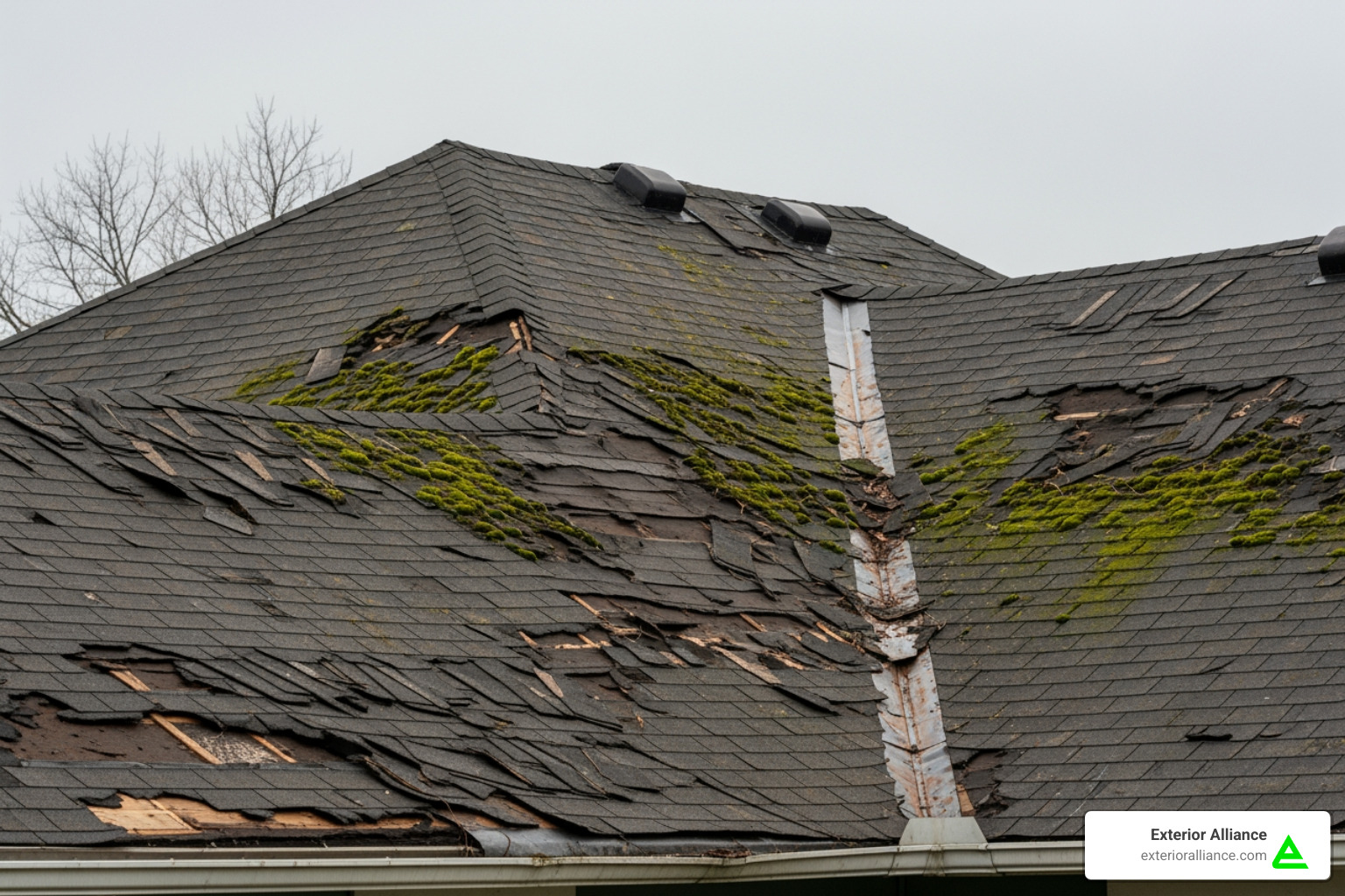 An old, deteriorating roof with missing shingles and moss growth