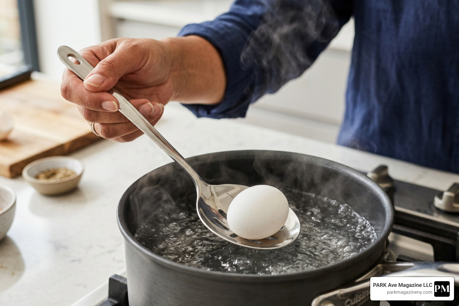 A person gently lowering a white egg into a pot of simmering water using a stainless steel slotted spoon - how long to boil A person gently lowering a white egg into a pot of simmering water using a stainless steel slotted spoon - how long to boil