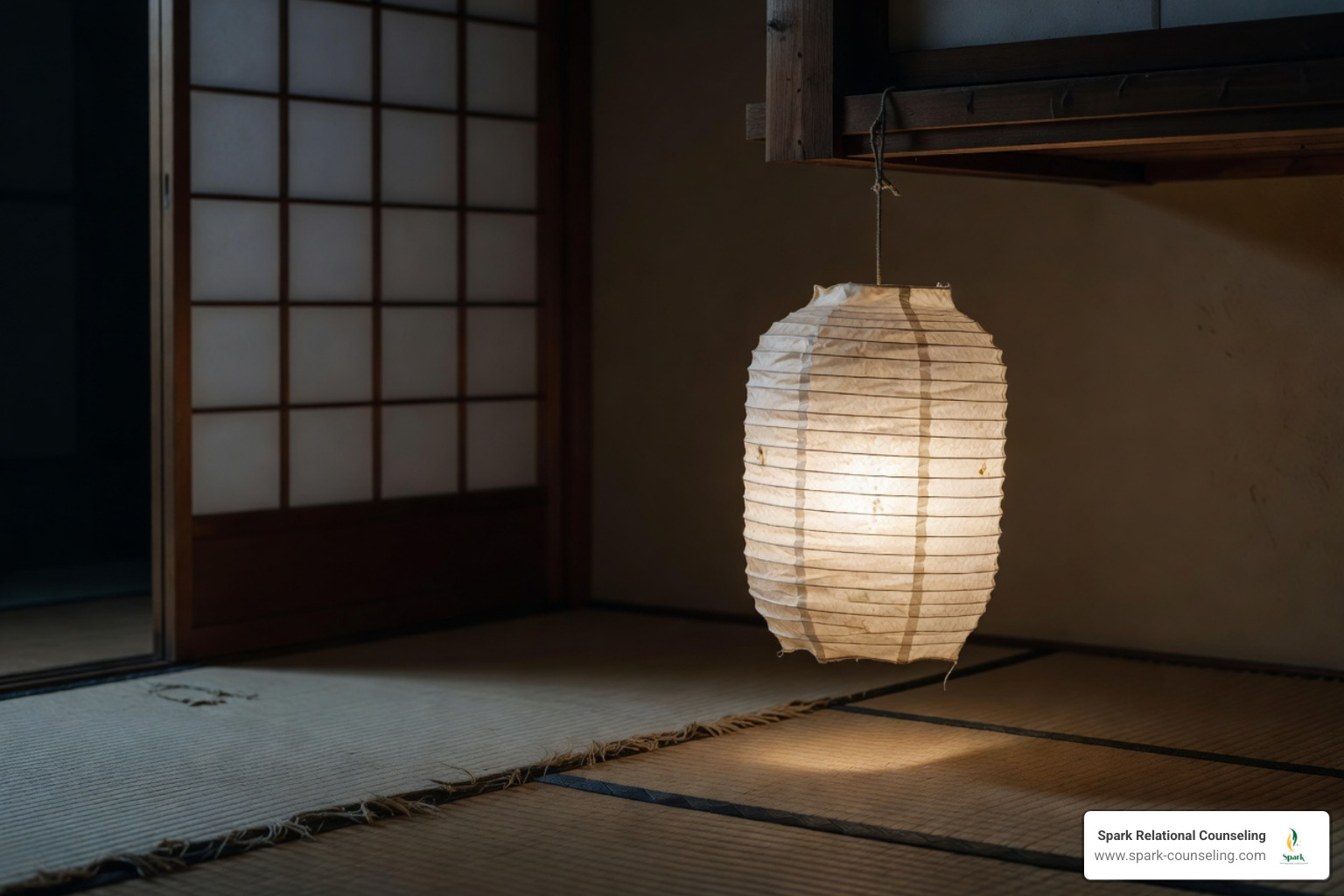 A lone lamp in a Japanese-style room, signaling the experience of burn out- feeling emotionally distant and numb - How to track burnout symptoms A lone lamp in a Japanese-style room, signaling the experience of burn out- feeling emotionally distant and numb - How to track burnout symptoms
