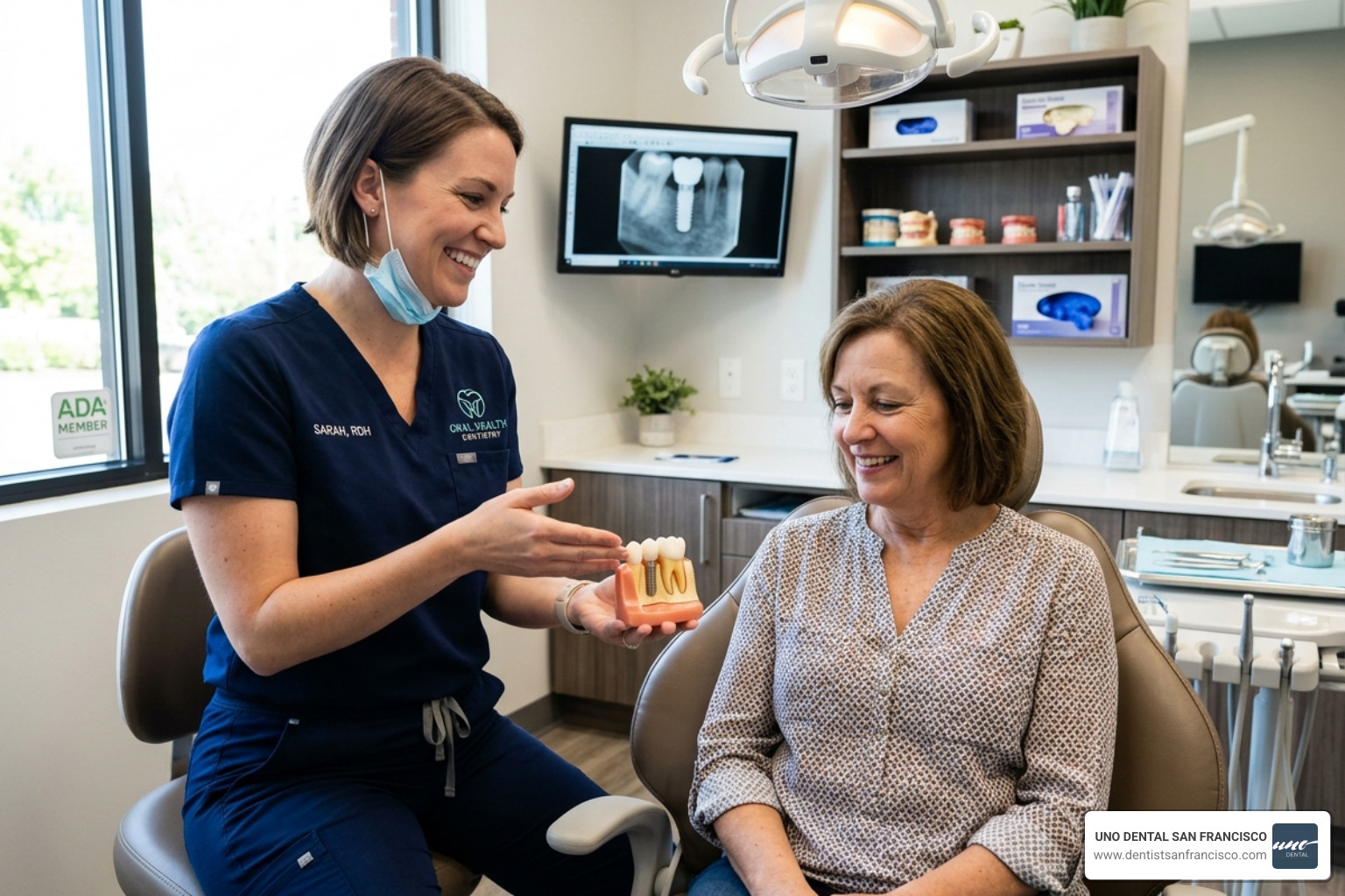 Dental professional showing a dental implant model to a patient - same day extraction Dental professional showing a dental implant model to a patient - same day extraction