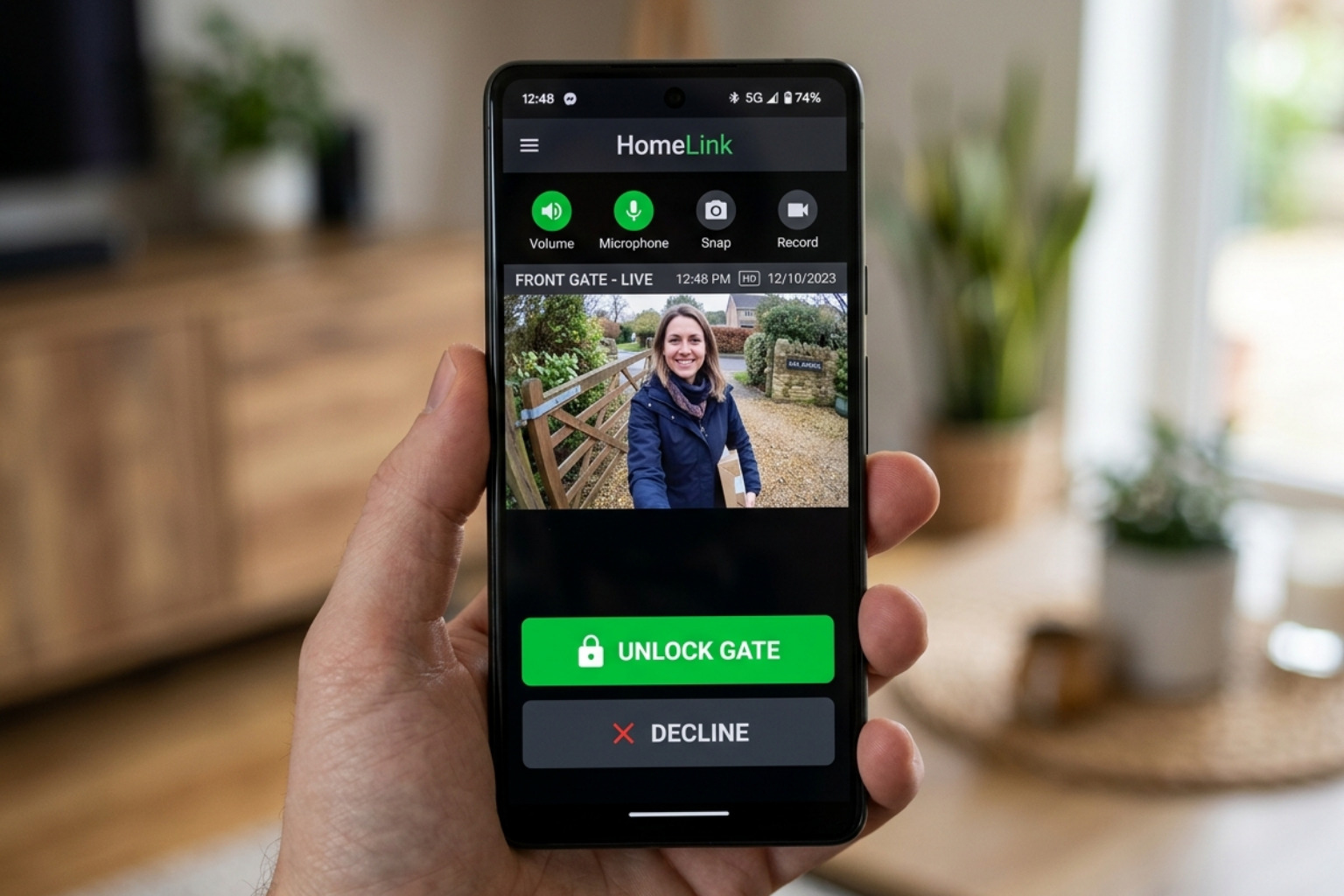 Smartphone app showing a live video feed from a gate intercom with an 'Unlock' button - intercom system installation Smartphone app showing a live video feed from a gate intercom with an 'Unlock' button - intercom system installation