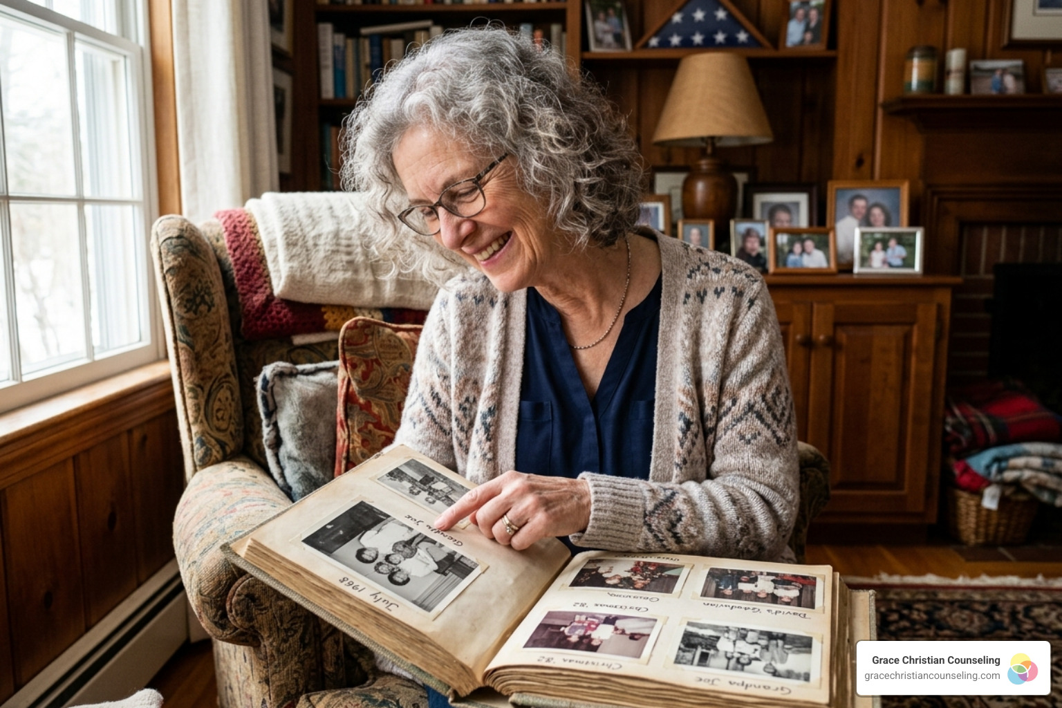 A senior woman smiling warmly while looking at old family photographs - Biblical counseling for seniors