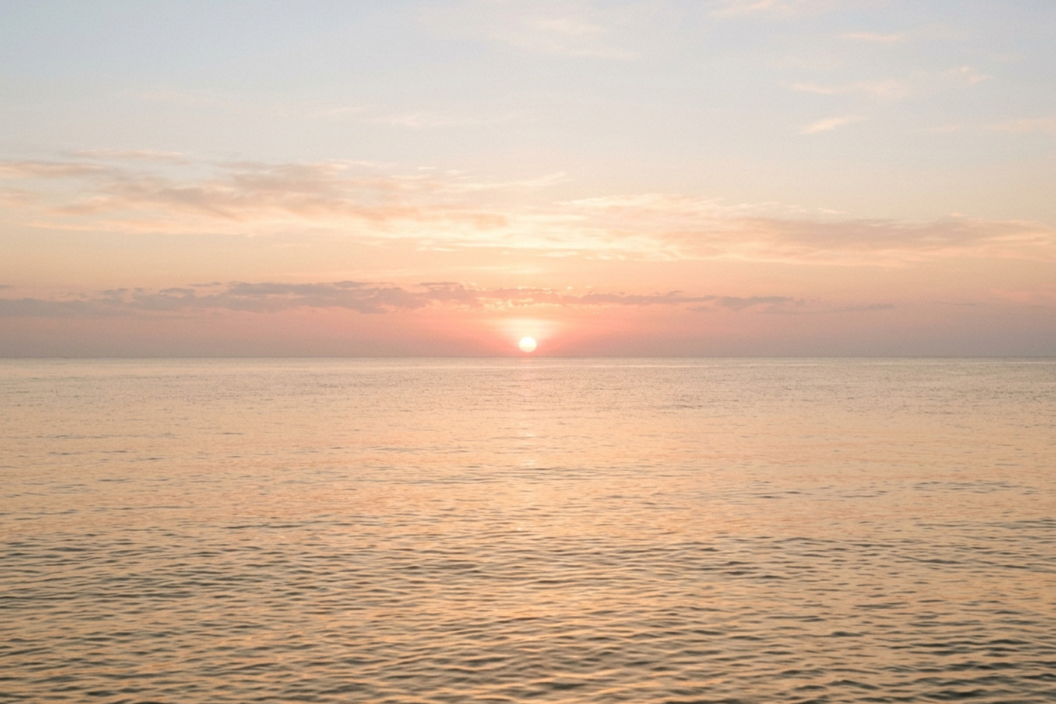 soft sunrise over a calm ocean with gentle light soft sunrise over a calm ocean with gentle light