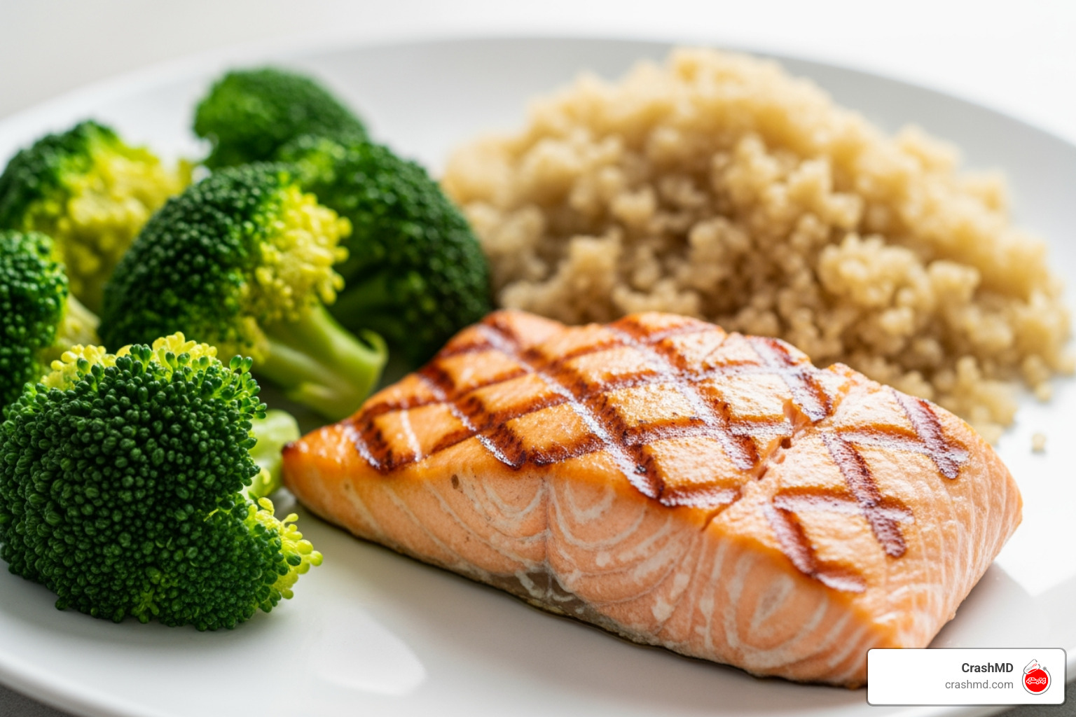 A high-protein recovery meal featuring grilled salmon, quinoa, and steamed broccoli A high-protein recovery meal featuring grilled salmon, quinoa, and steamed broccoli