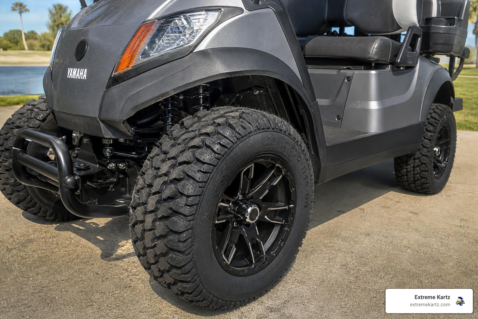 A close-up shot showing the clearance between a large 23-inch all-terrain tire and the front fender of a lifted Yamaha golf