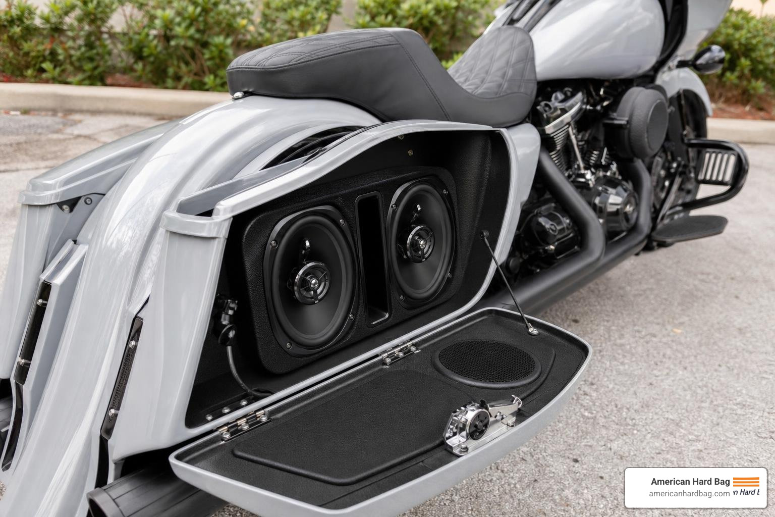 A high-performance 6x9 inch saddlebag speaker kit installed on a custom Harley-Davidson bagger