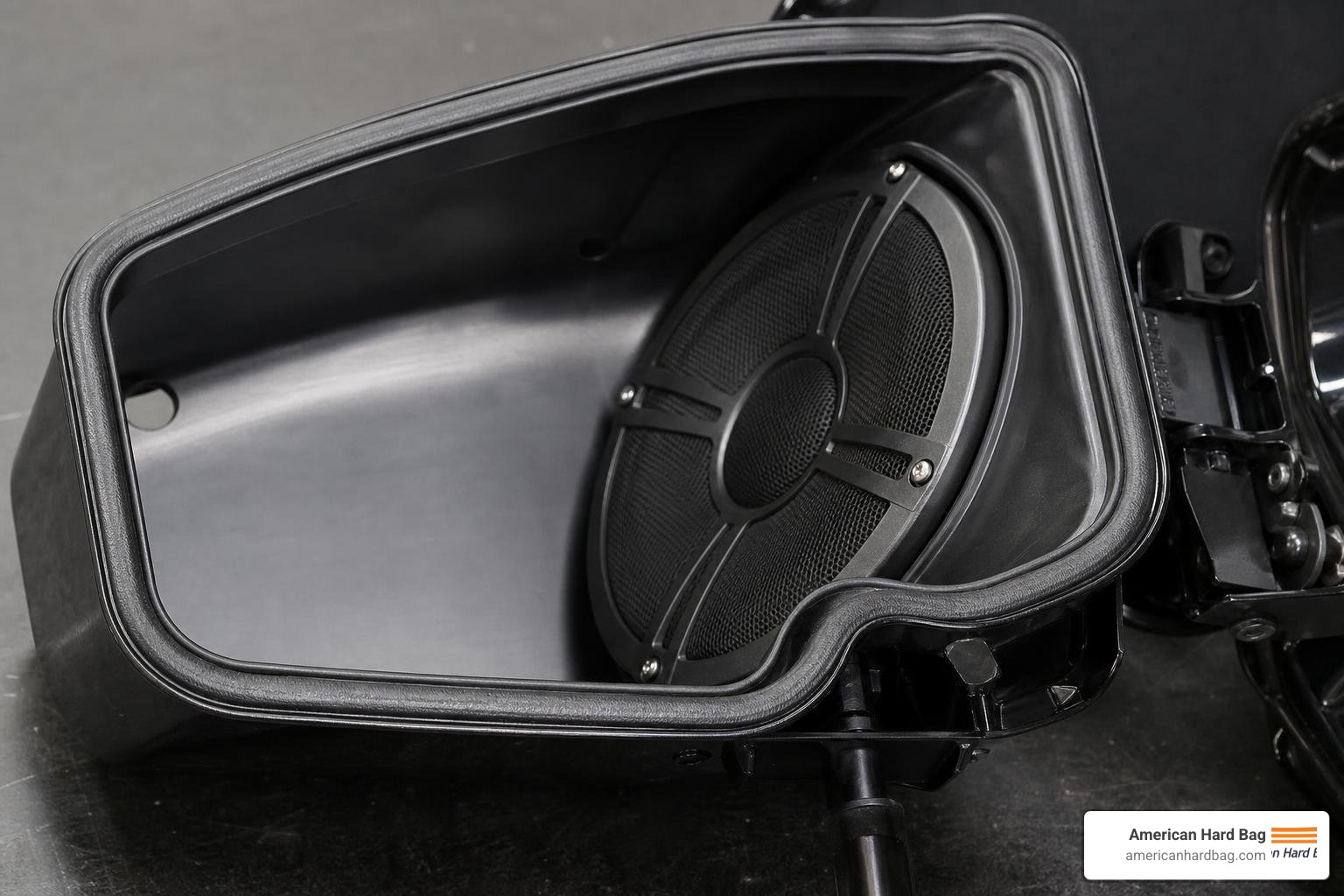 Saddlebag speaker lid showing angled speaker placement and water-resistant gaskets