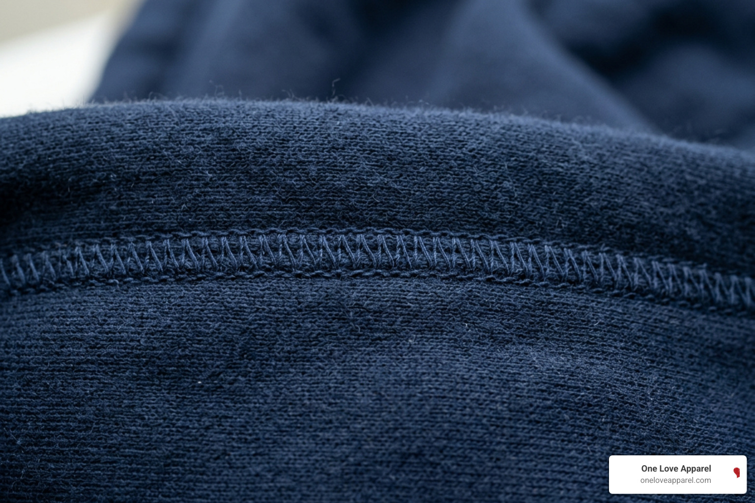 Close-up of high-quality flatlock stitching and durable cotton fabric texture Close-up of high-quality flatlock stitching and durable cotton fabric texture