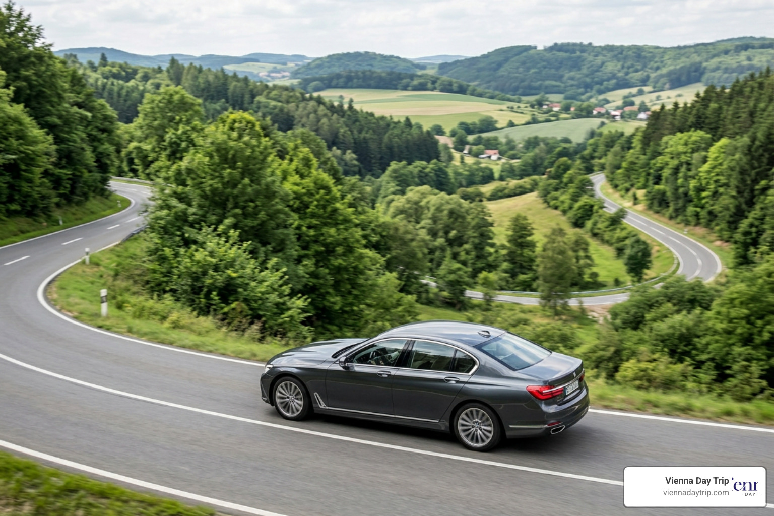 Luxury Mercedes sedan on a scenic European road