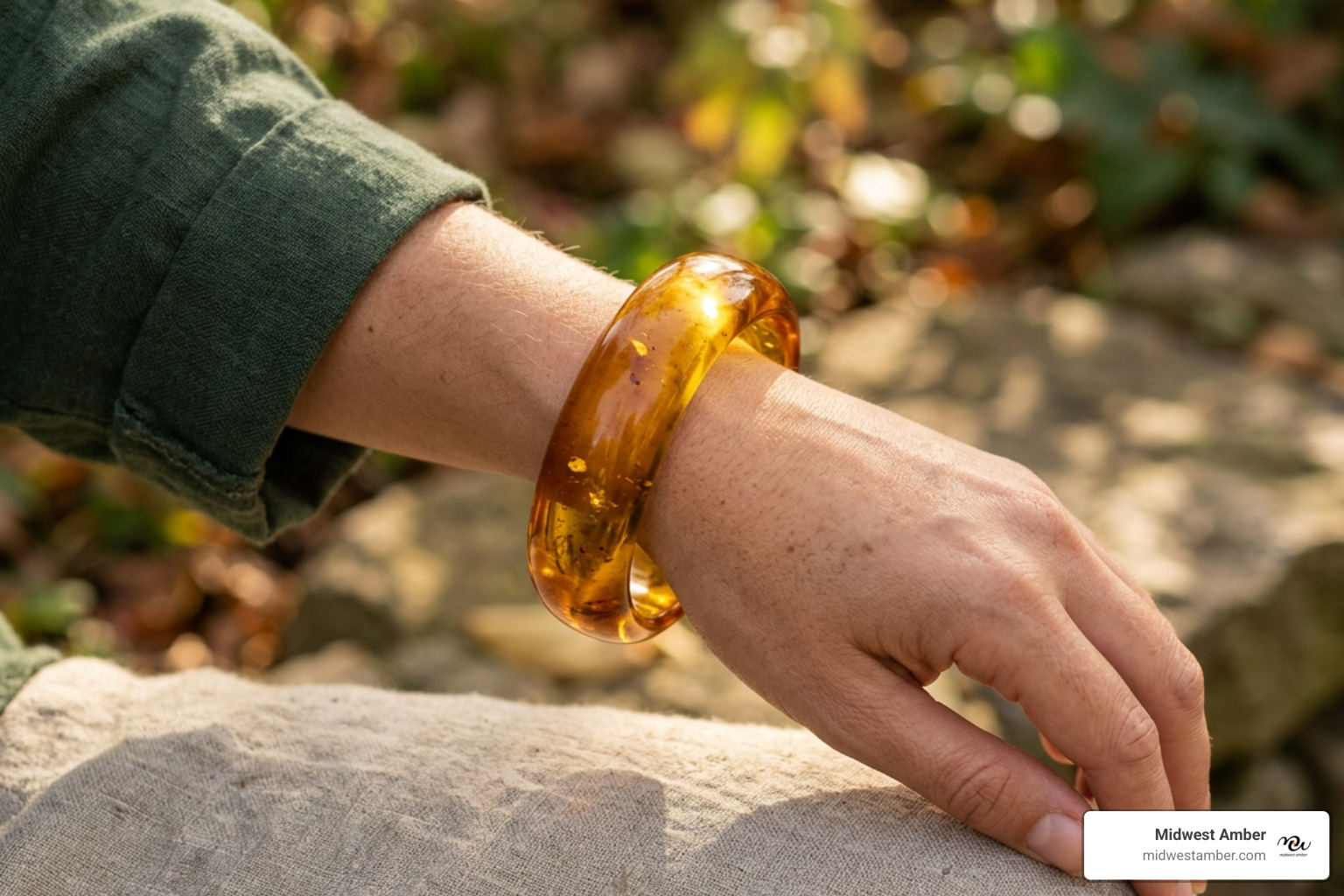 amber bangle bracelet on wrist with warm Baltic amber glow