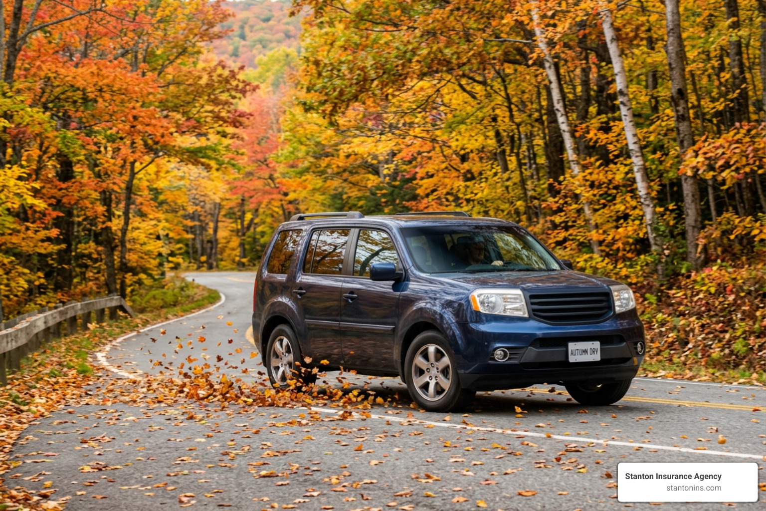 Honda Pilot driving through autumn leaves
