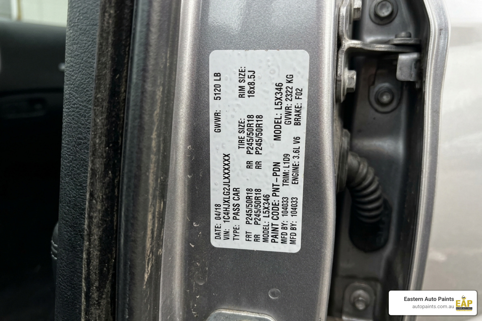 paint code on car door jamb sticker close-up paint code on car door jamb sticker close-up