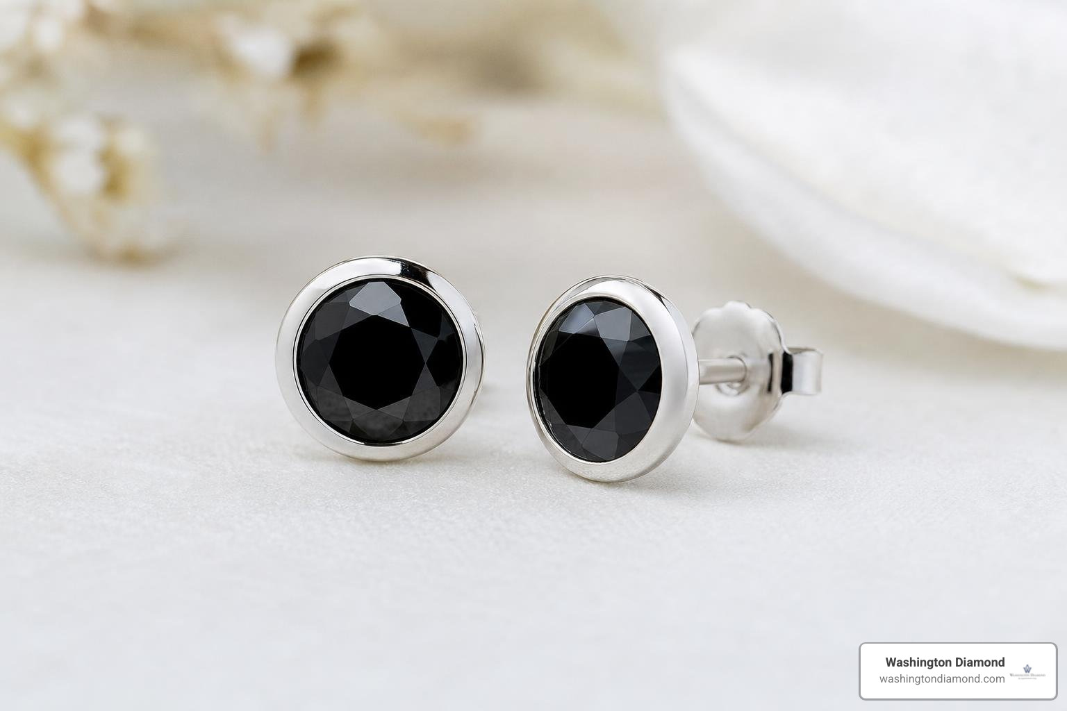A pair of elegant black diamond bezel earrings in white gold A pair of elegant black diamond bezel earrings in white gold