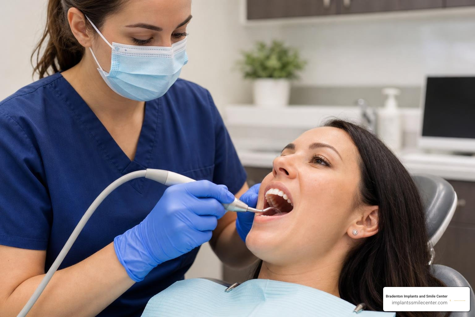 dental hygienist using an ultrasonic scaler to clean plaque