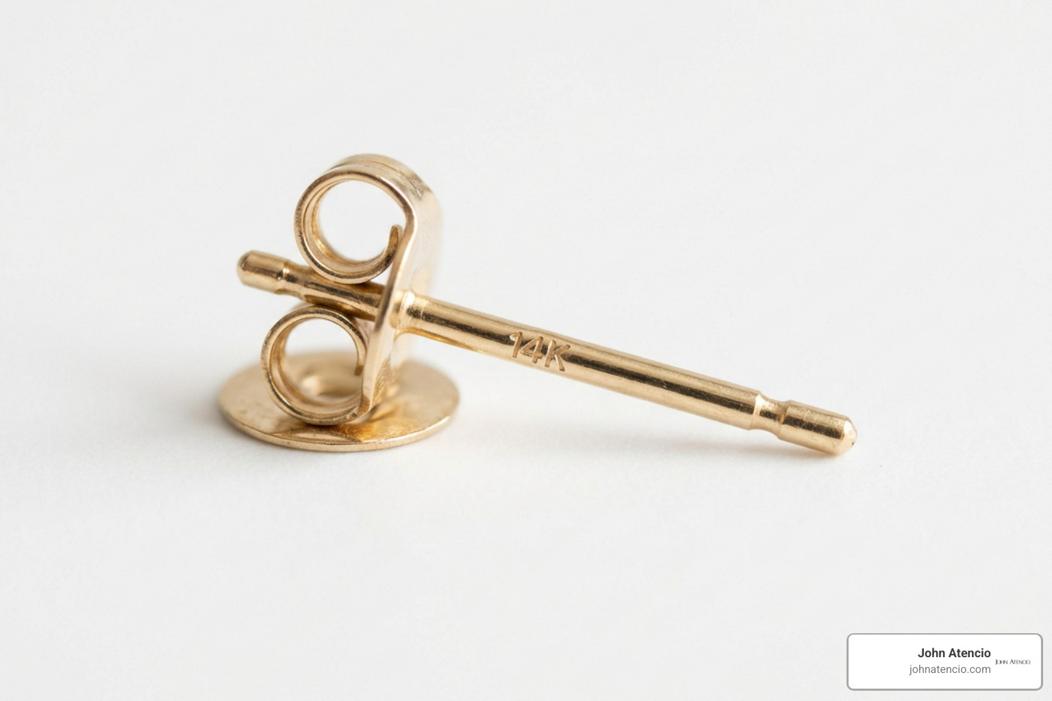 gold hallmark stamp on earring post showing karat certification