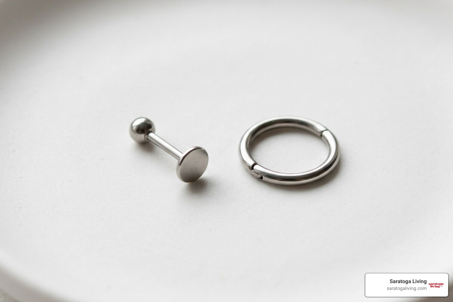 Starter flat-back labret stud next to a healed seamless clicker hoop Starter flat-back labret stud next to a healed seamless clicker hoop
