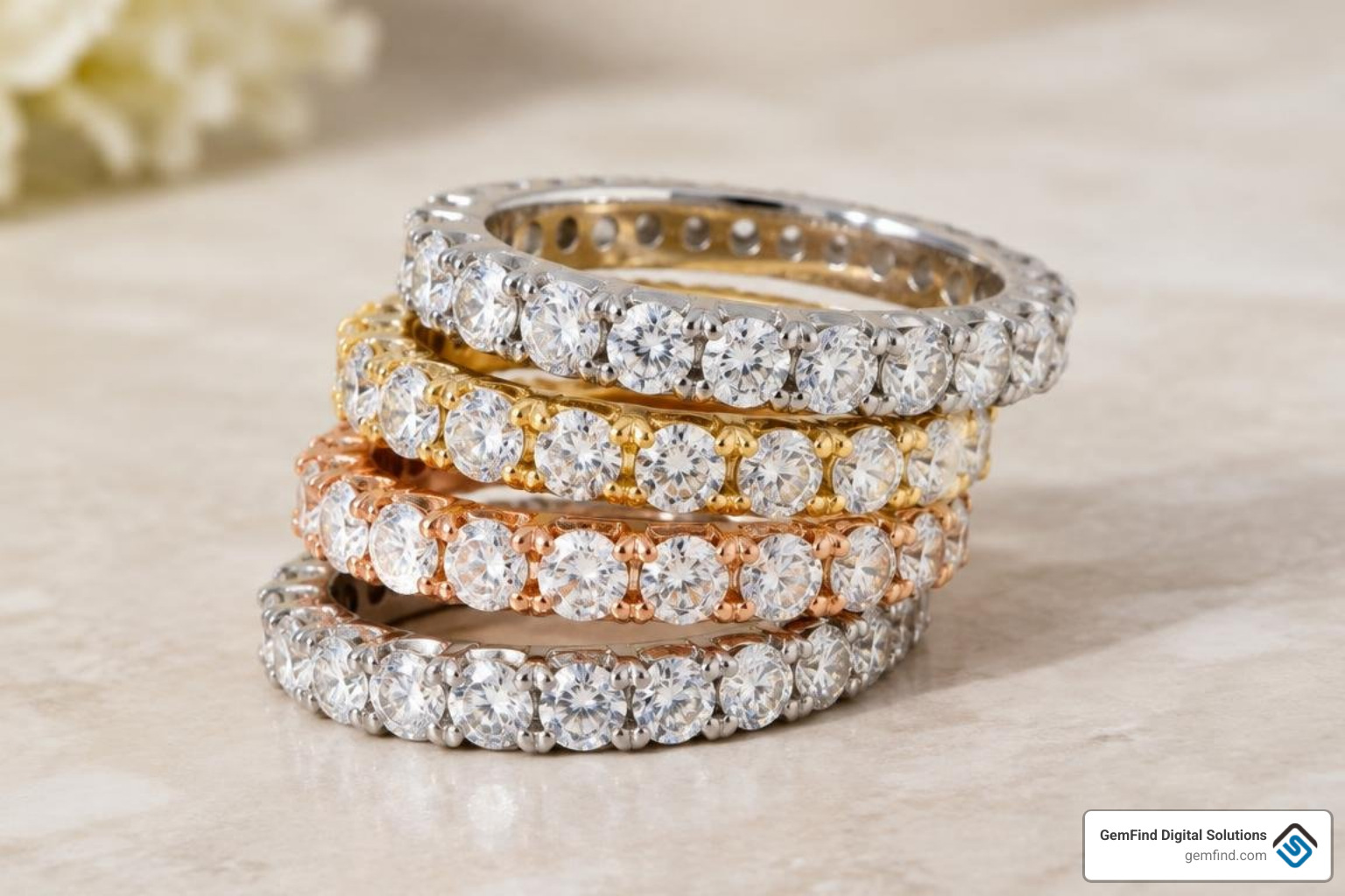 Collection of stacked diamond eternity bands in mixed precious metals Collection of stacked diamond eternity bands in mixed precious metals