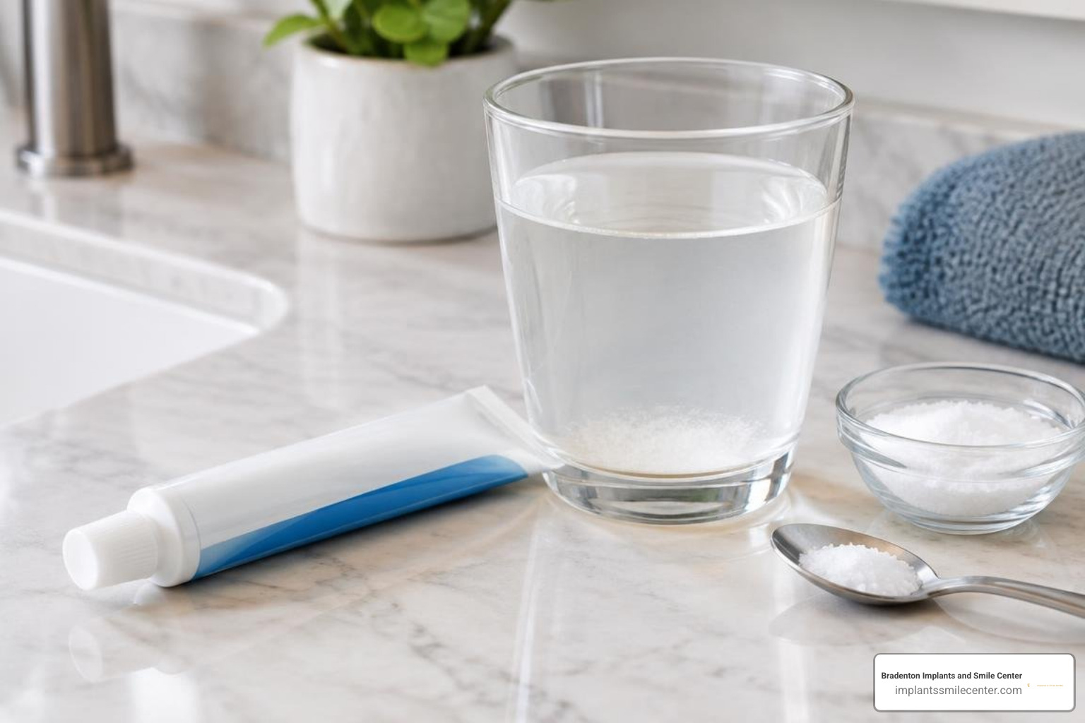 Oral numbing gel and warm salt water rinse on a bathroom counter