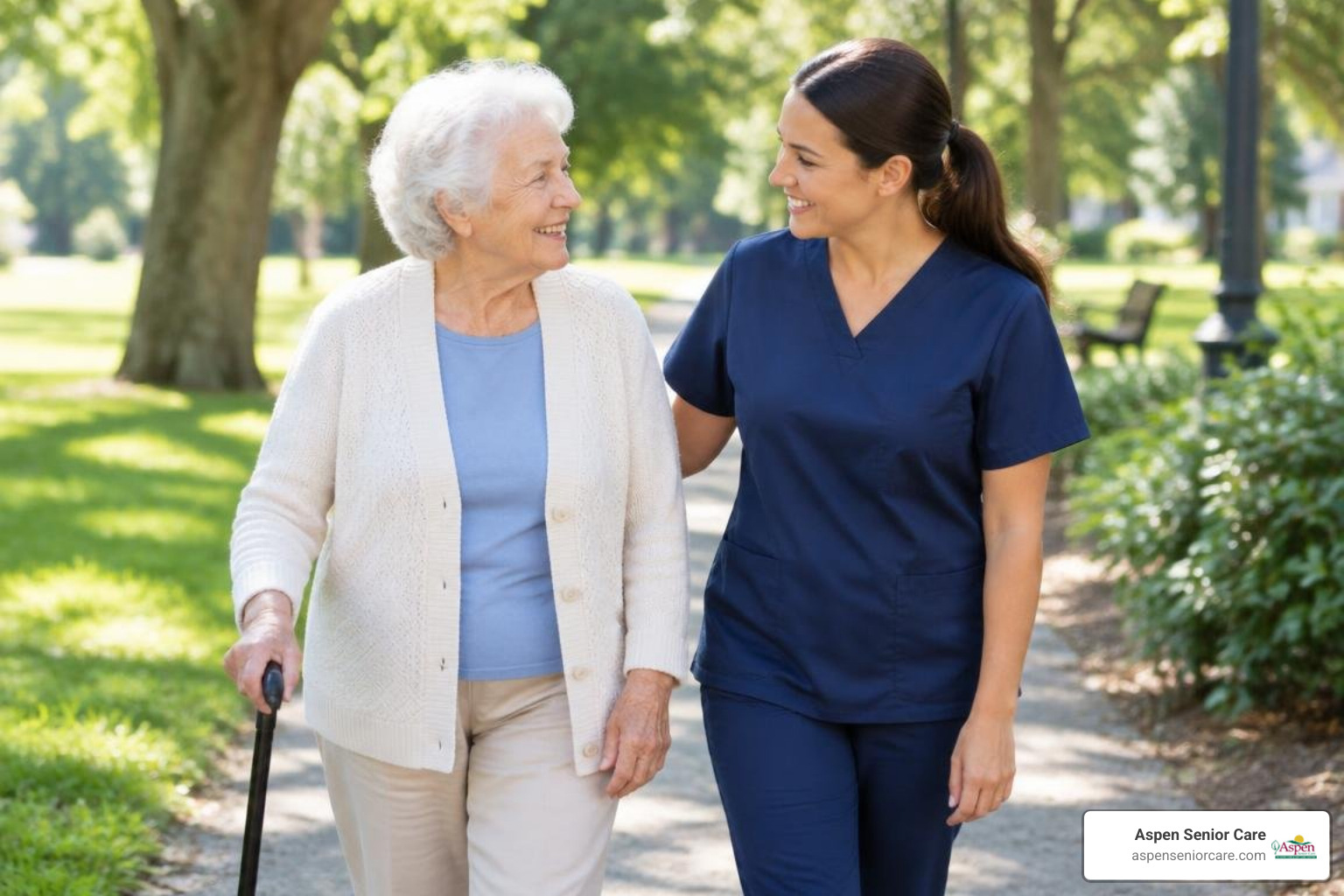 older adult walking outdoors with an attentive caregiver